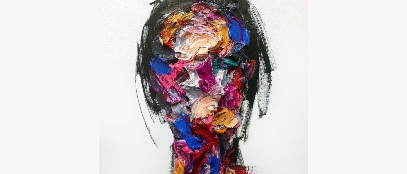 painting of a woman's face with multiple paint colors