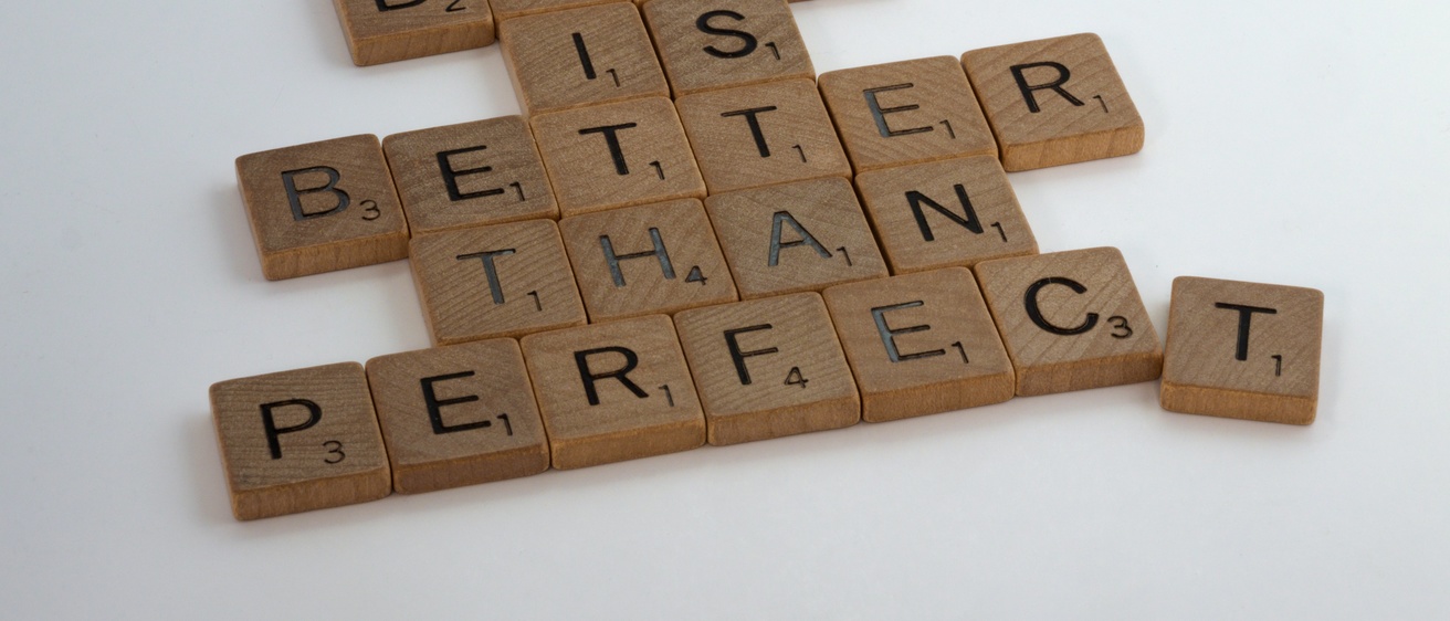 scrabble letters that read "done is better than perfect"