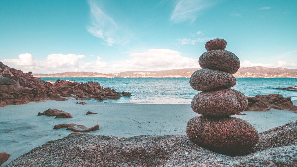 Rocks balancing near a shoreline