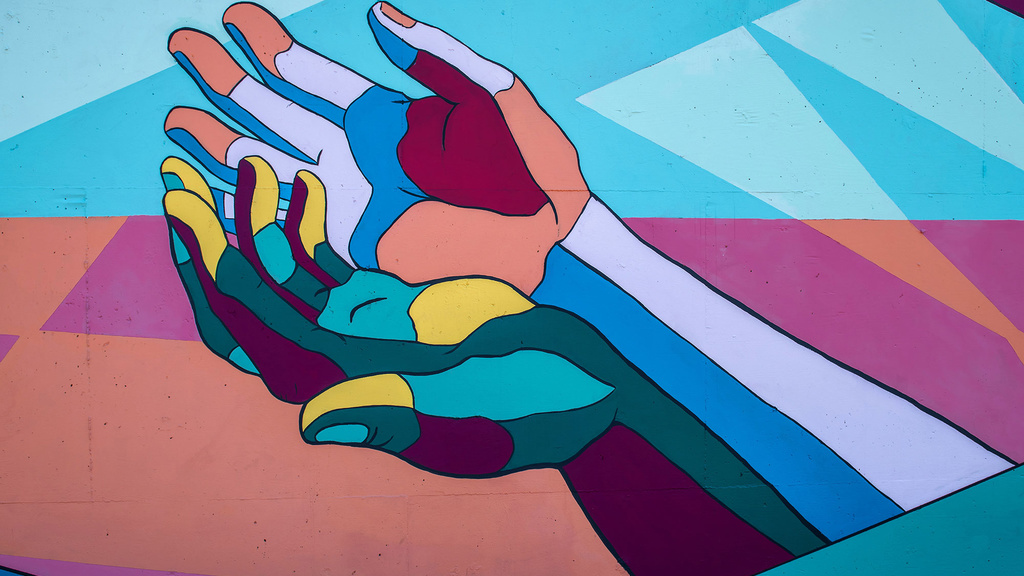 A colorful abstract illustration of two hands